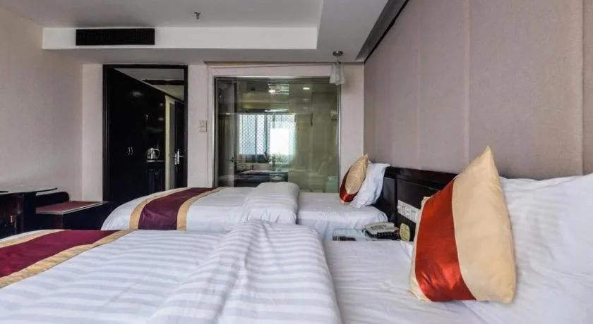 Bed in New World Hotel