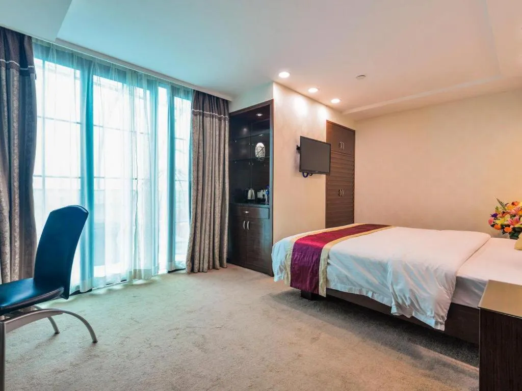 Bed in New World Hotel