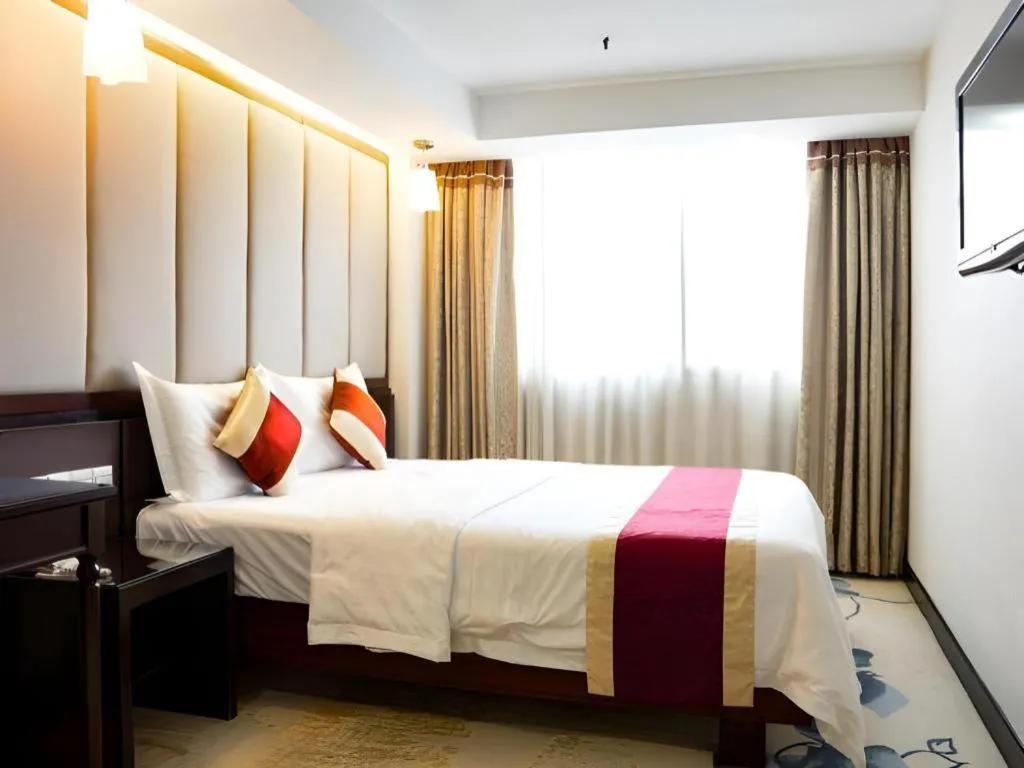 Bed in New World Hotel