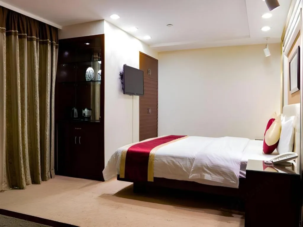 Bed in New World Hotel