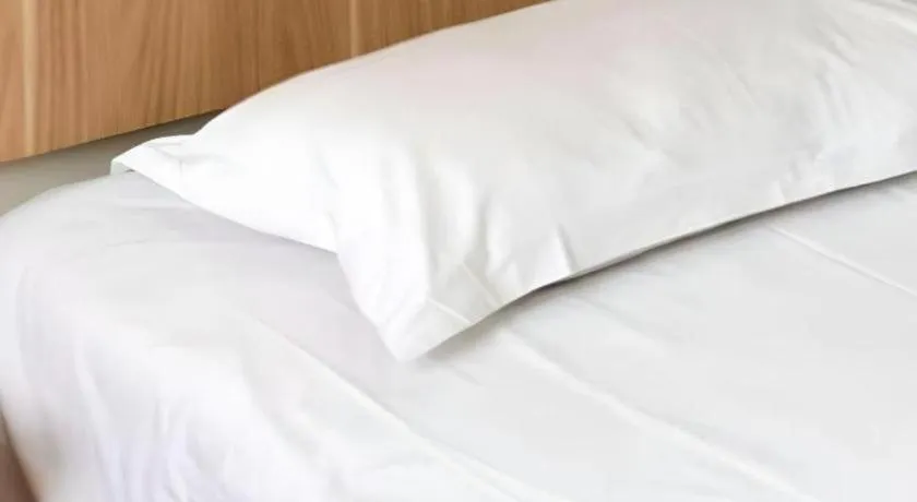 Bed in New World Hotel