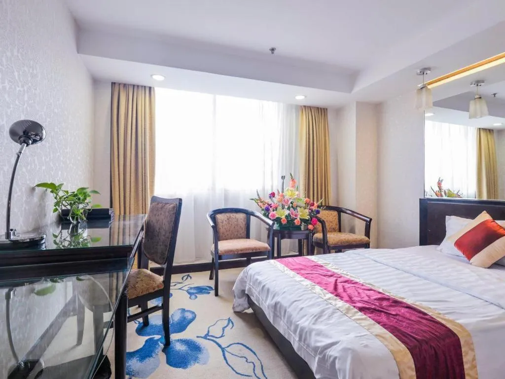 Bed in New World Hotel