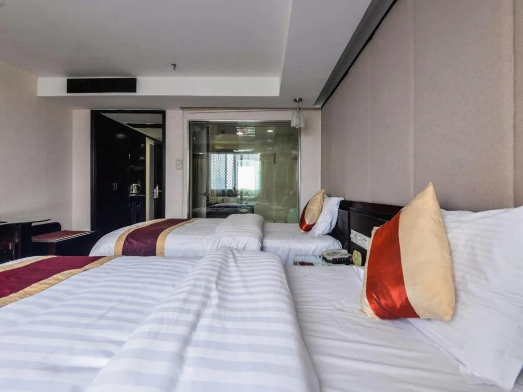 Bed in New World Hotel