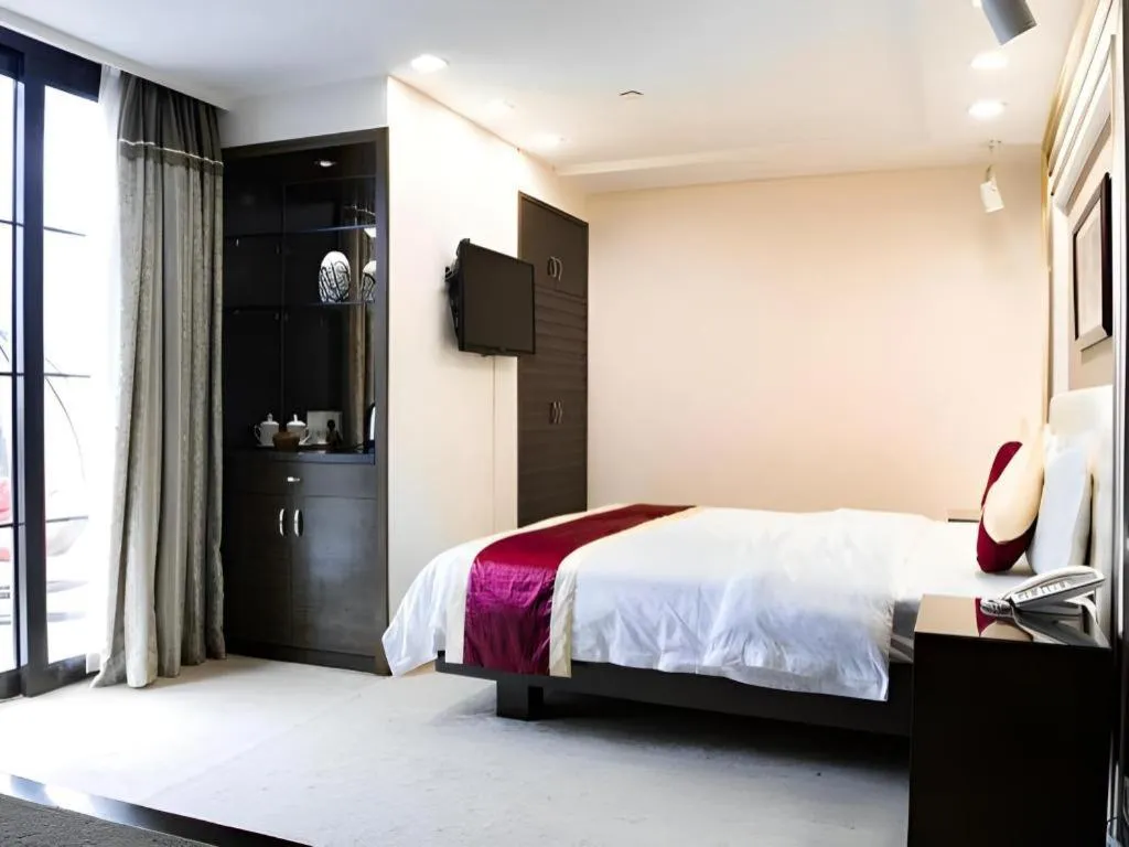 Bed in New World Hotel