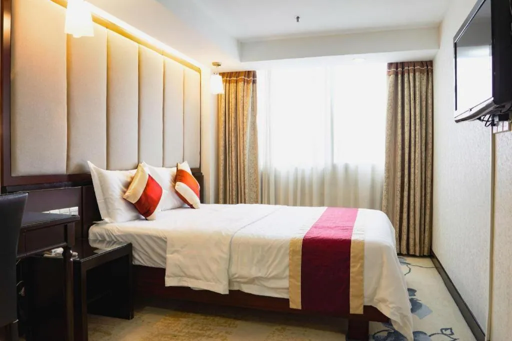 Bed in New World Hotel