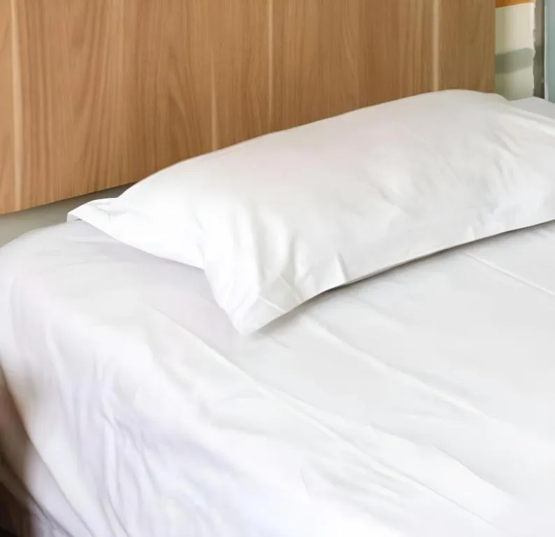 Bed in New World Hotel