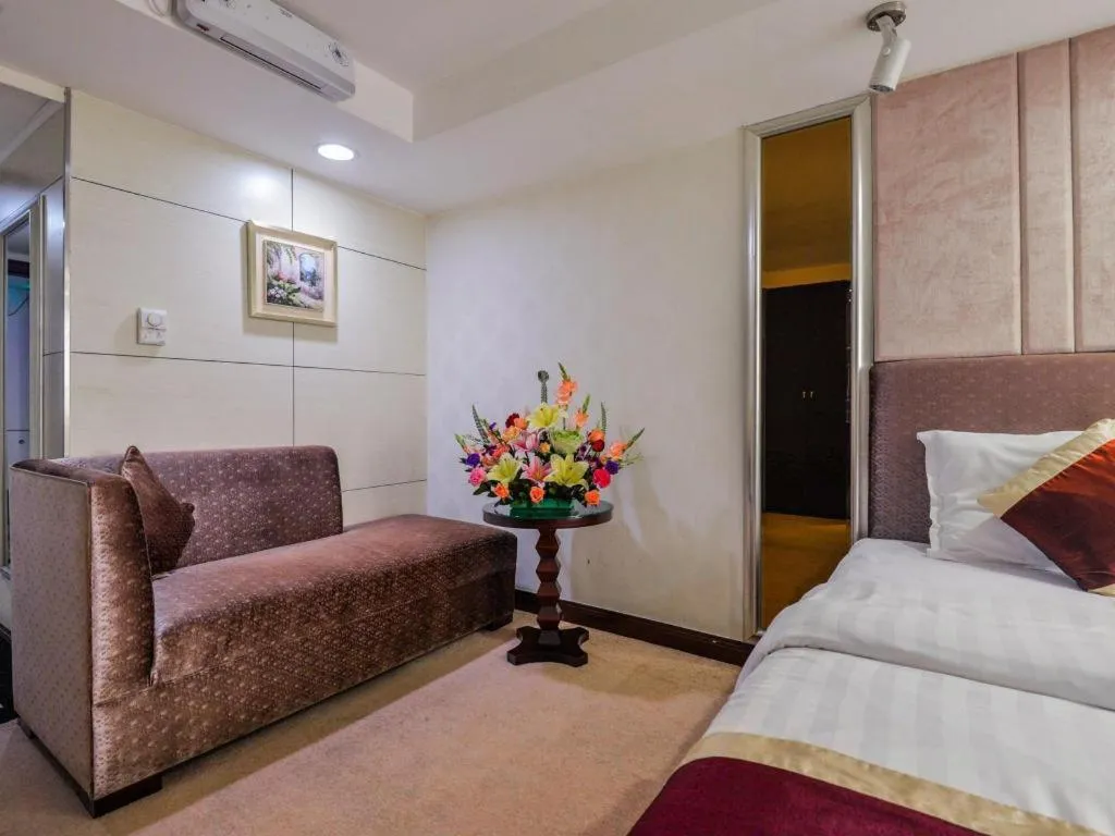 Bed in New World Hotel