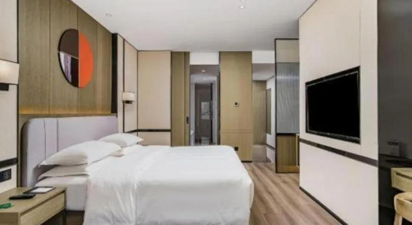 Bed in Zhong Yi Peng Ao Hotel