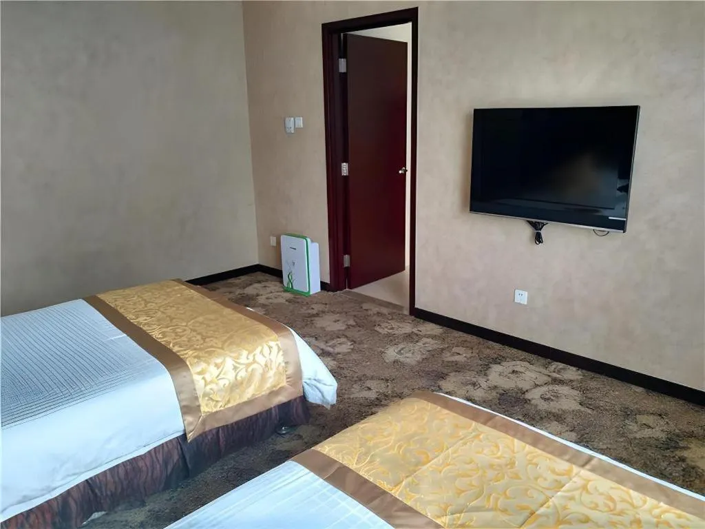 Bed in Zhong Yi Peng Ao Hotel