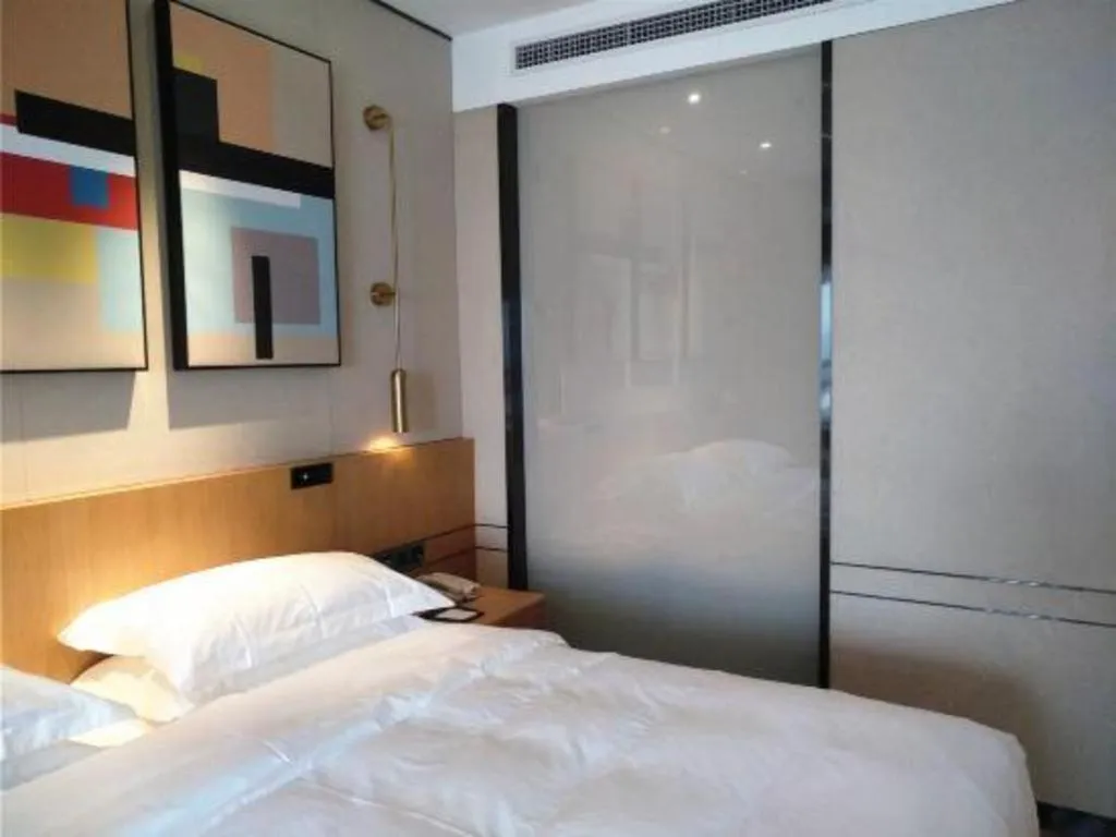 Bed in Zhong Yi Peng Ao Hotel