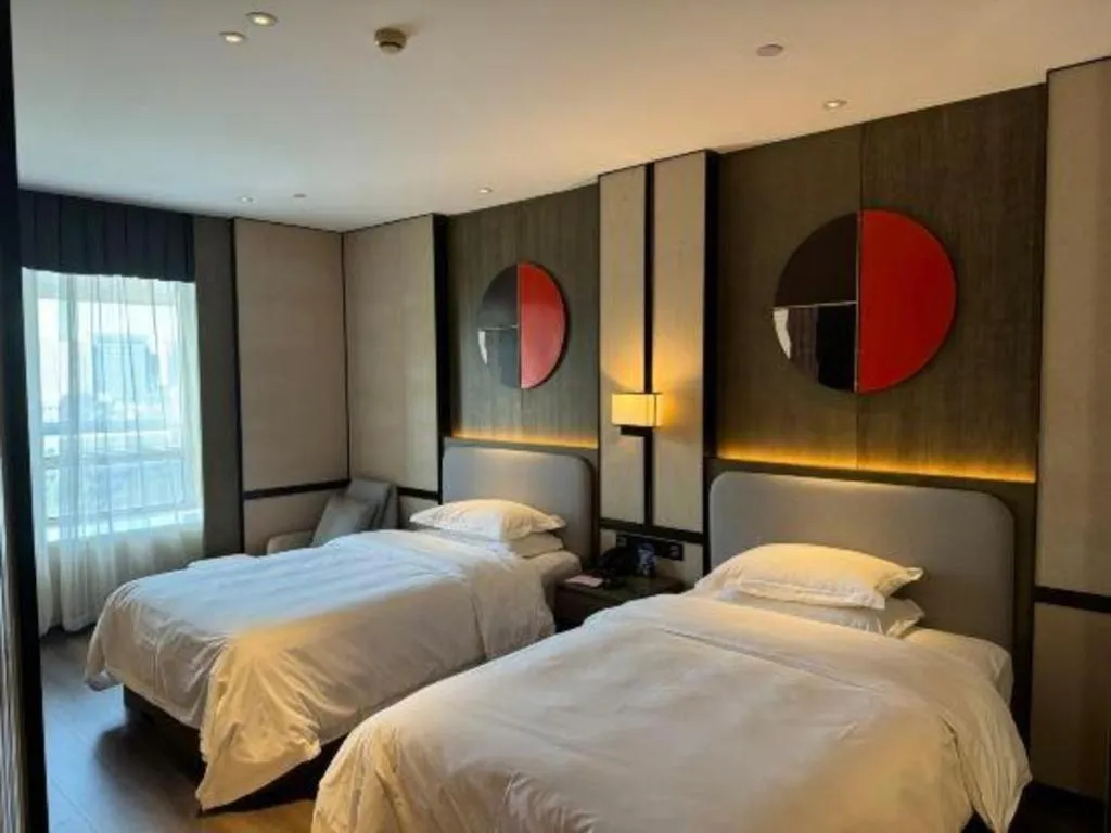 Bed in Zhong Yi Peng Ao Hotel