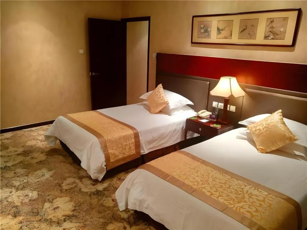 Bed in Zhong Yi Peng Ao Hotel