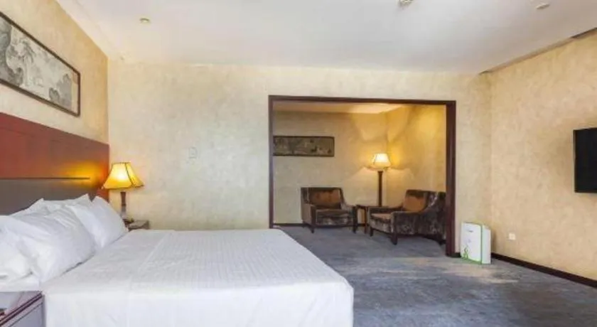 Bed in Zhong Yi Peng Ao Hotel