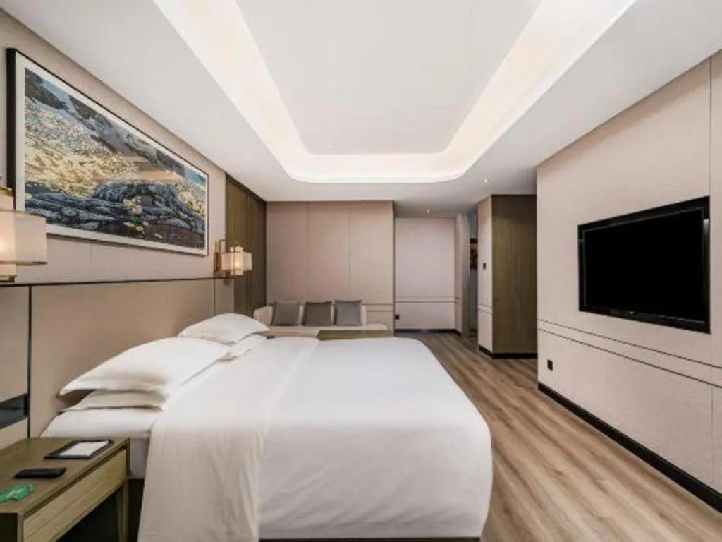 Bed in Zhong Yi Peng Ao Hotel