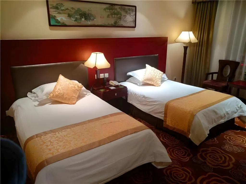 Bed in Zhong Yi Peng Ao Hotel