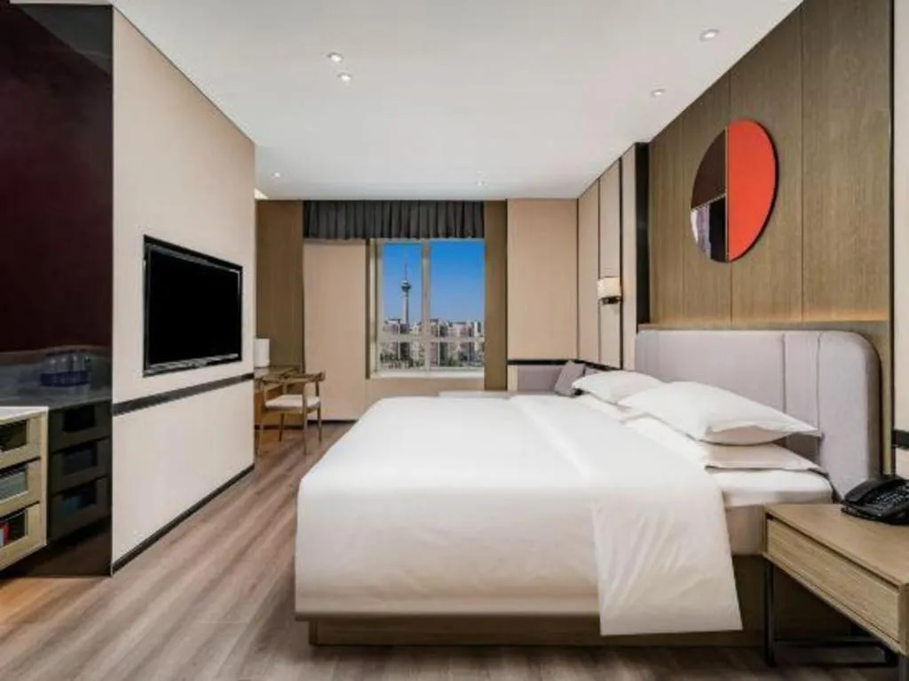 Bed in Zhong Yi Peng Ao Hotel