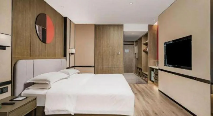 Bed in Zhong Yi Peng Ao Hotel