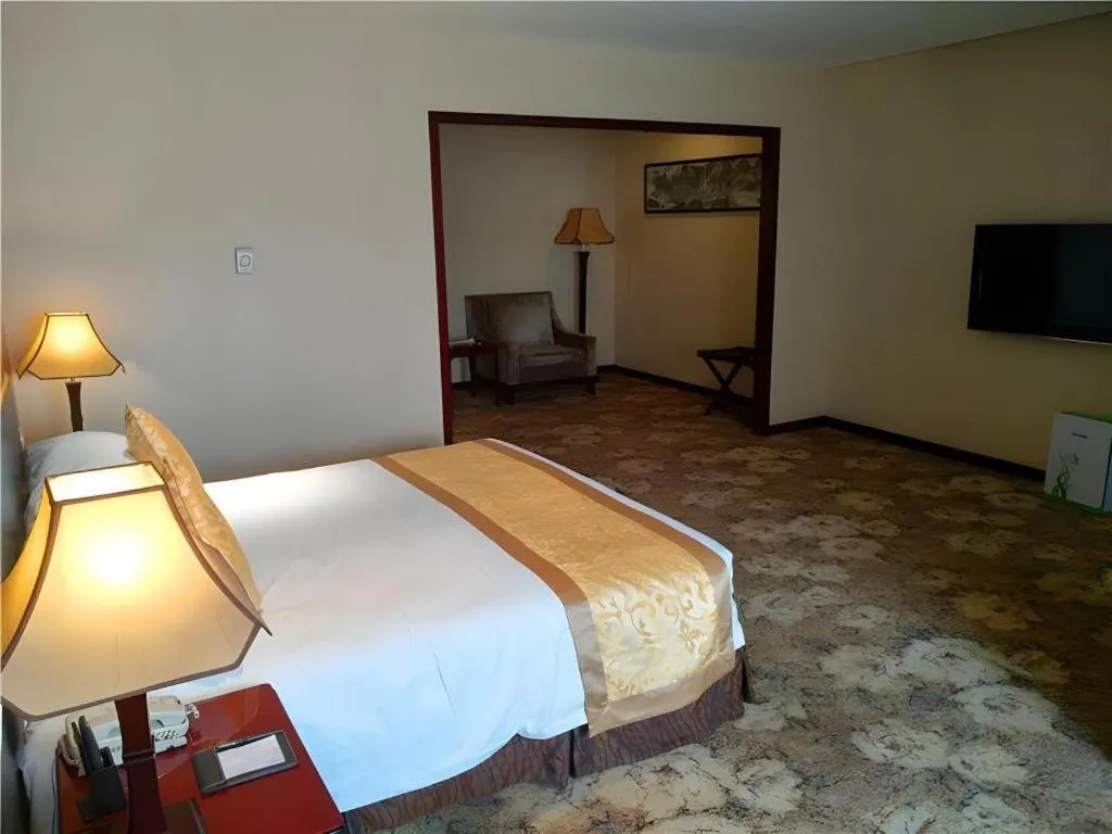 Bed in Zhong Yi Peng Ao Hotel