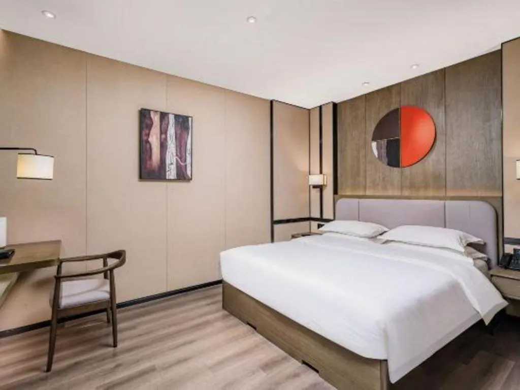 Bed in Zhong Yi Peng Ao Hotel