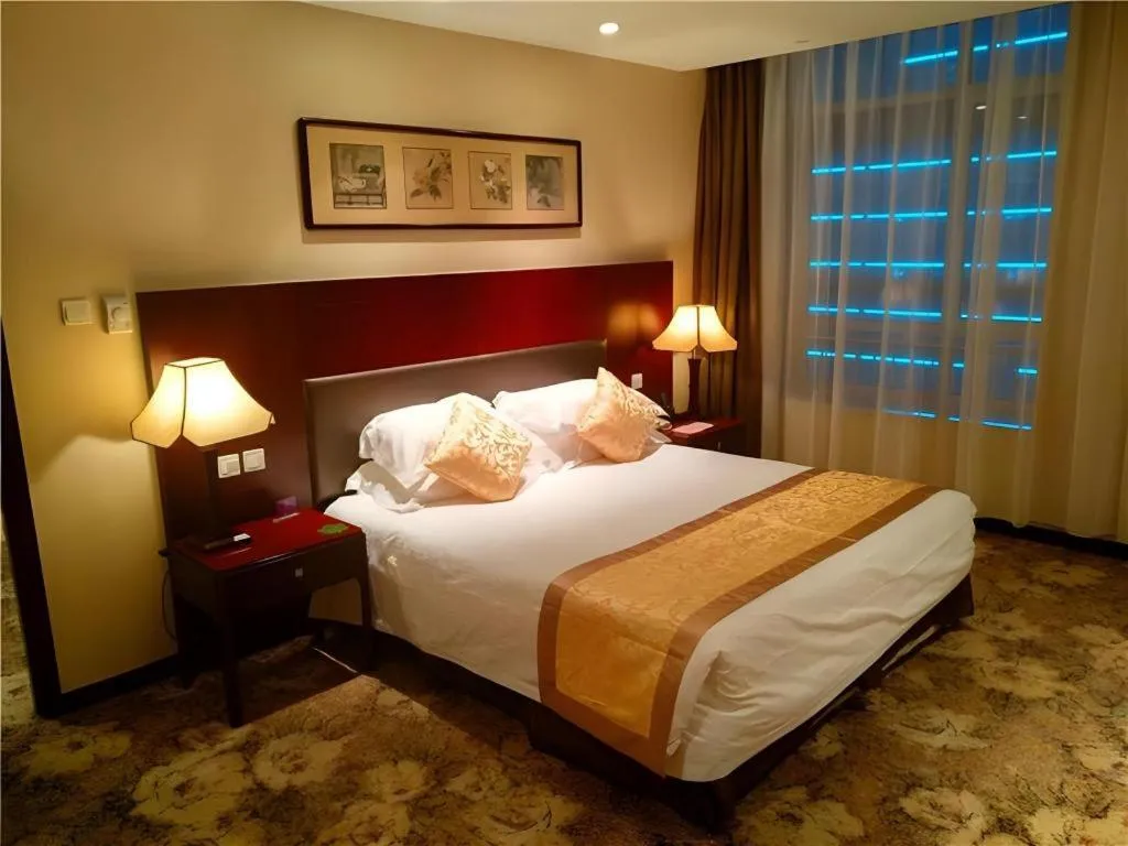 Bed in Zhong Yi Peng Ao Hotel