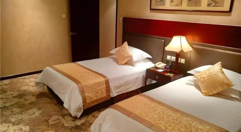 Bed in Zhong Yi Peng Ao Hotel