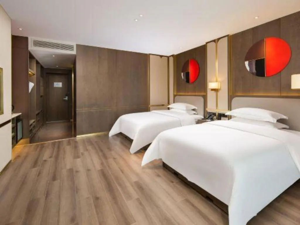 Bed in Zhong Yi Peng Ao Hotel