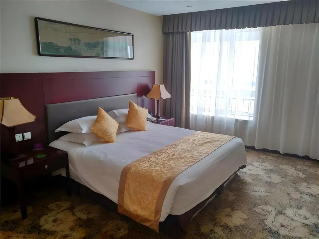 Bed in Zhong Yi Peng Ao Hotel