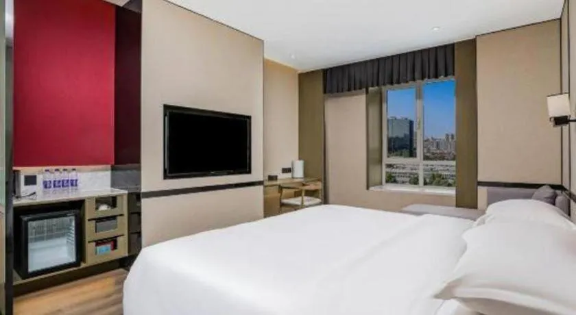 Bed in Zhong Yi Peng Ao Hotel