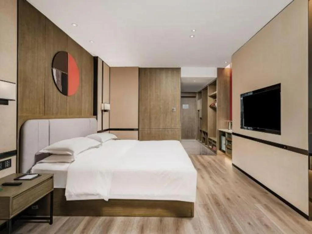 Bed in Zhong Yi Peng Ao Hotel