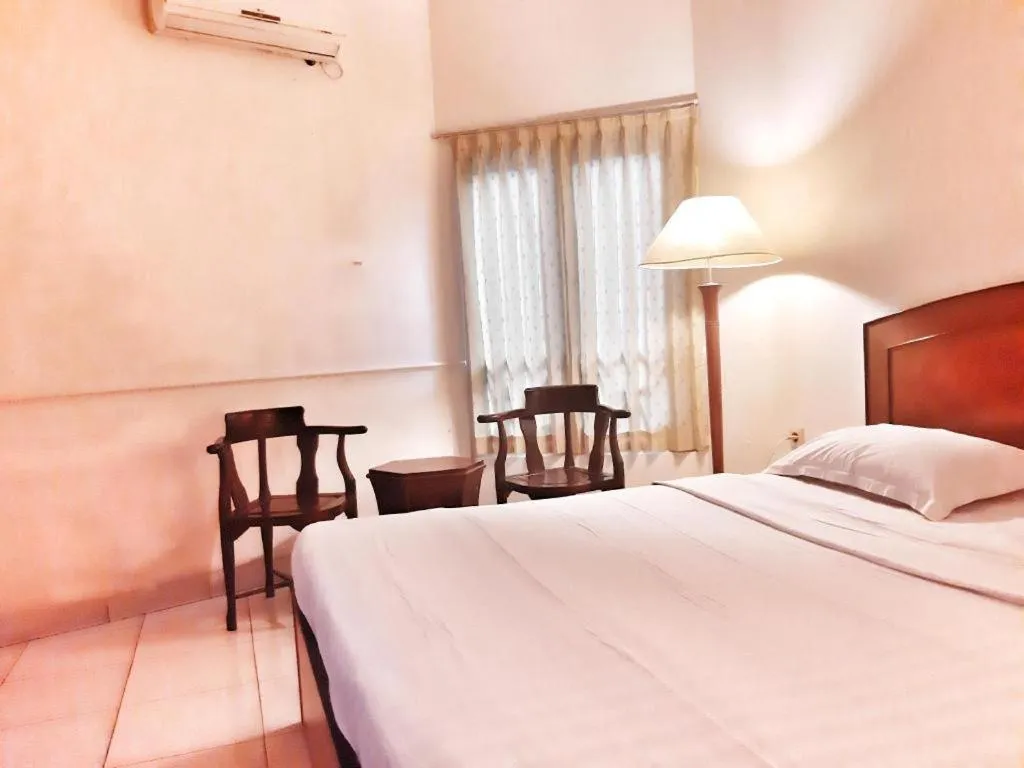 Bed in Alexander Hotel Tegal