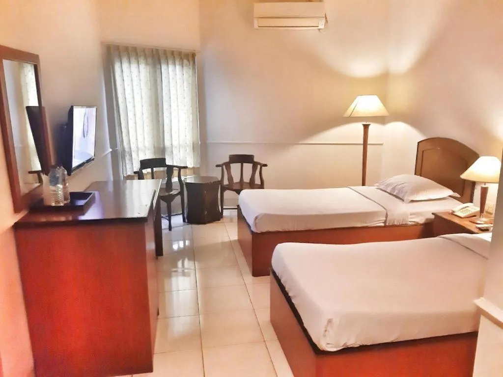 Bed in Alexander Hotel Tegal