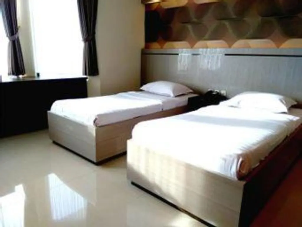 Bed in Alexander Hotel Tegal