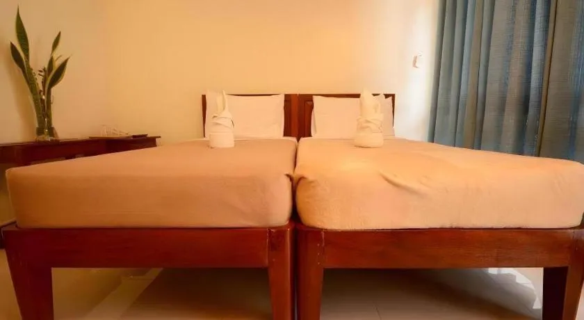 Bed in Ipil Suites El Nido