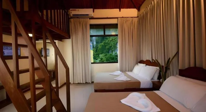 Bed in Ipil Suites El Nido