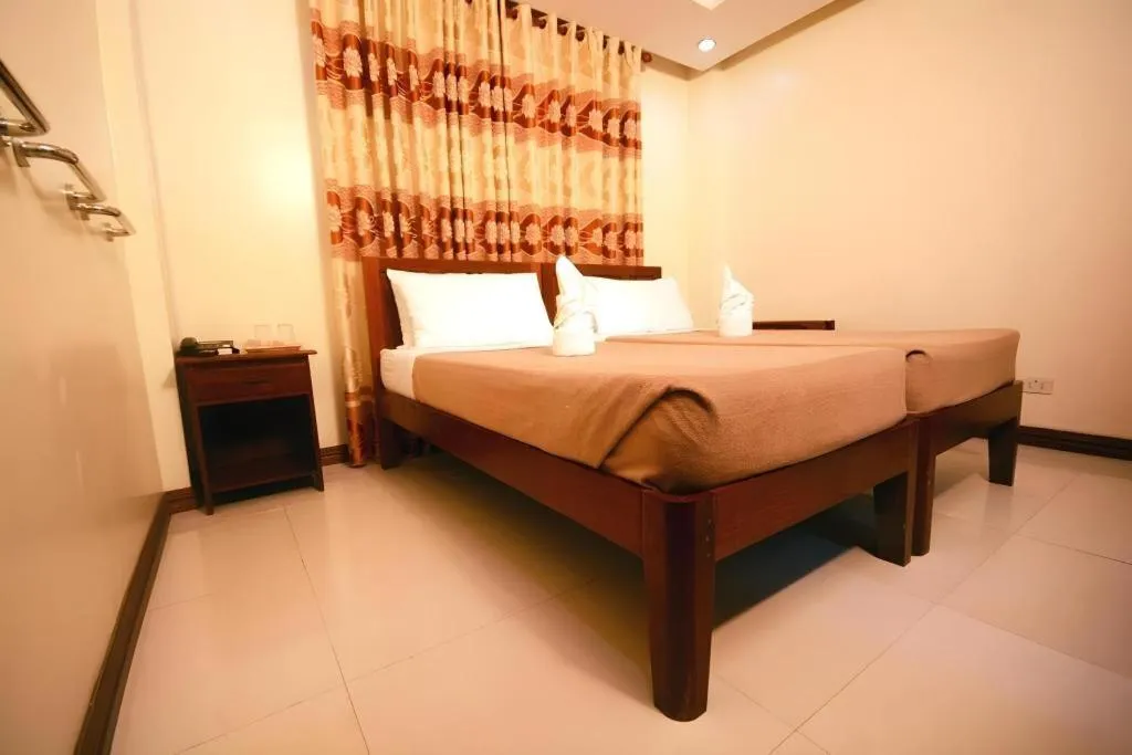 Bed in Ipil Suites El Nido
