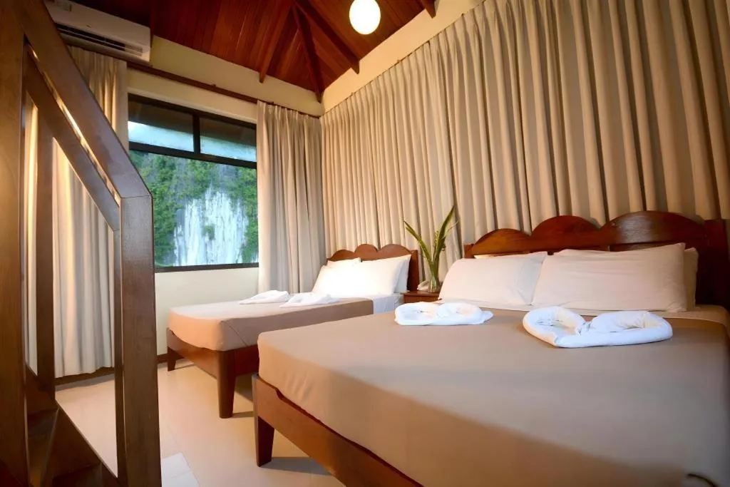 Bed in Ipil Suites El Nido