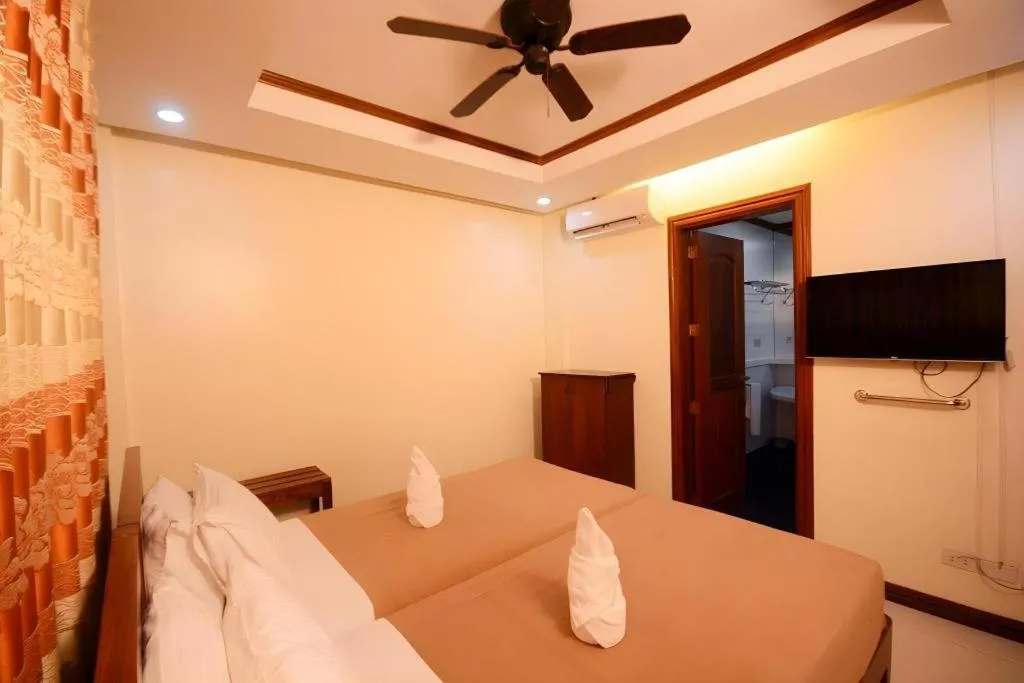 Bed in Ipil Suites El Nido