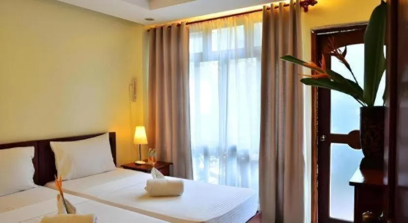 Bed in Ipil Suites El Nido