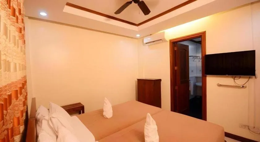 Bed in Ipil Suites El Nido