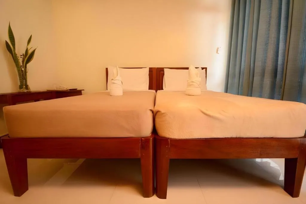 Bed in Ipil Suites El Nido