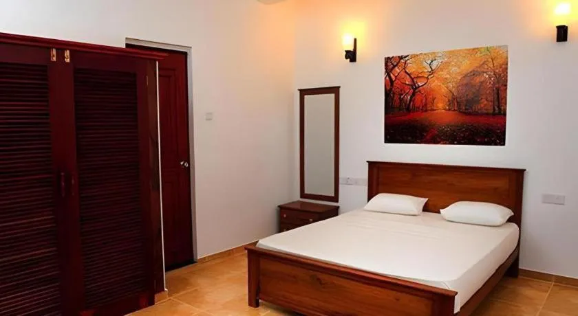 Bed in OYO 246 Roy Villa Beach Hotel