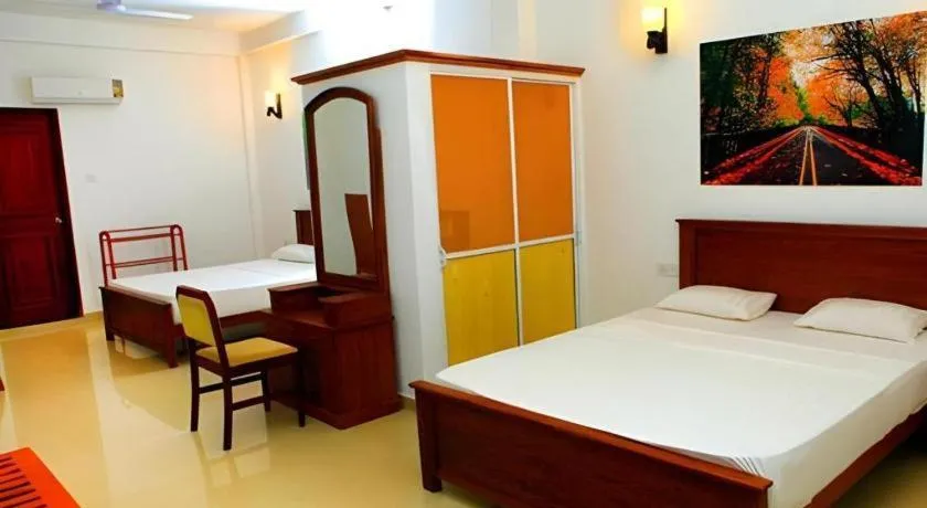 Bed in OYO 246 Roy Villa Beach Hotel