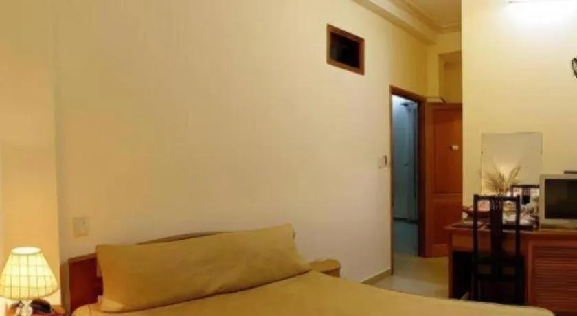 Bed in Gold Night Hotel