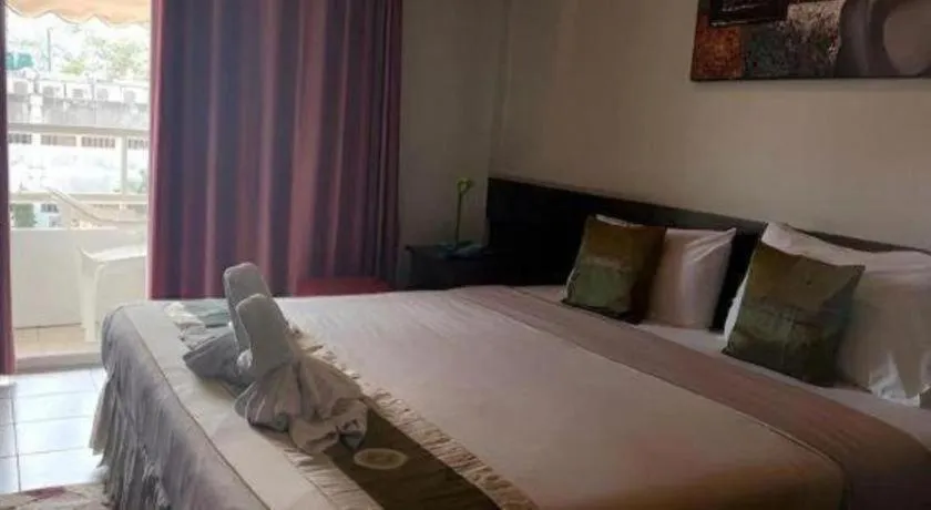 Bed in The Nice Patong Hotel