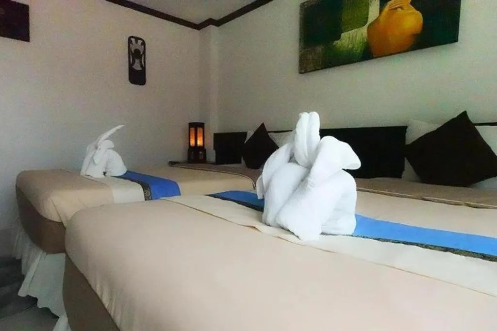 Bed in The Nice Patong Hotel