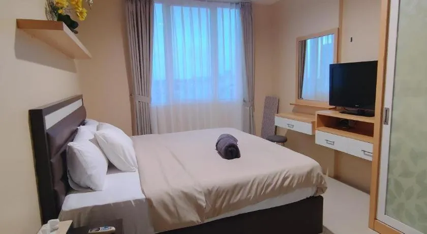 Bed in The BCC Hotel & Residence