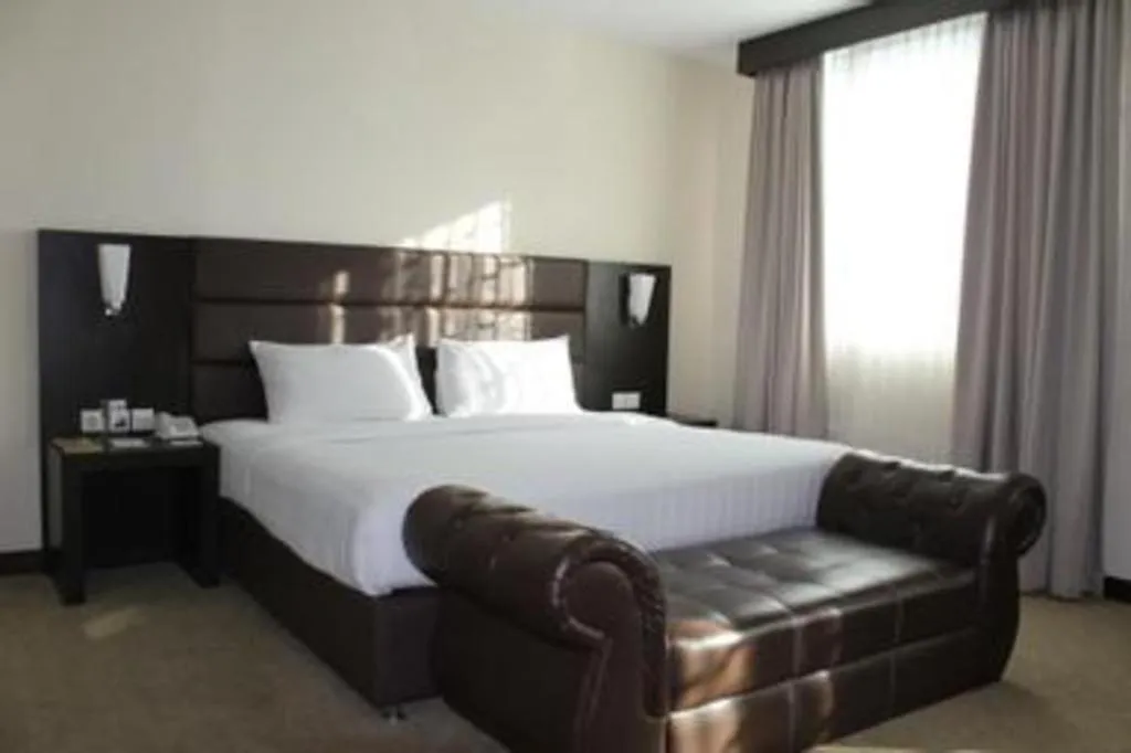 Bed in The BCC Hotel & Residence