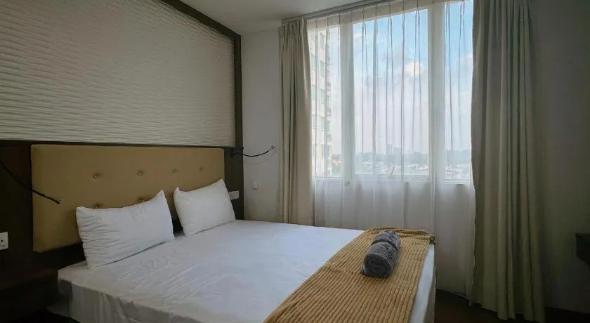 Bed in The BCC Hotel & Residence