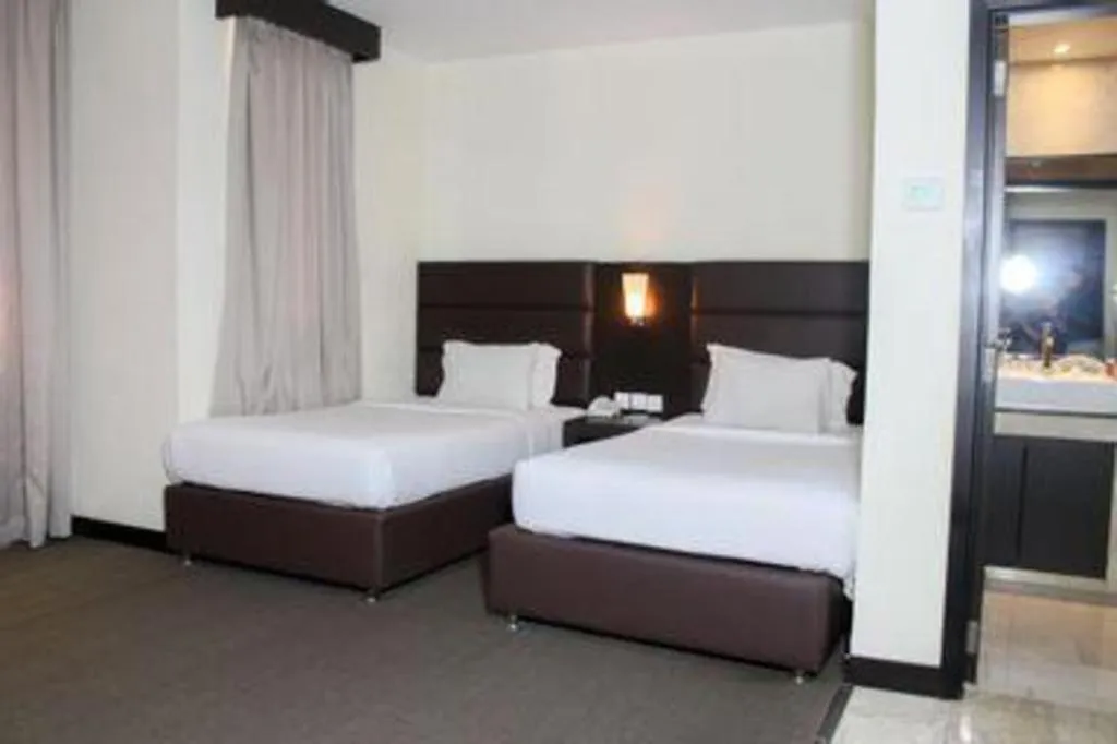 Bed in The BCC Hotel & Residence