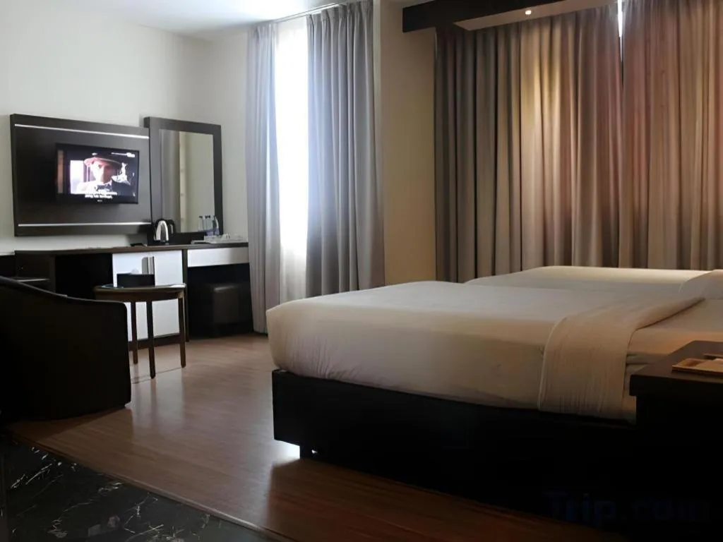 Bed in The BCC Hotel & Residence